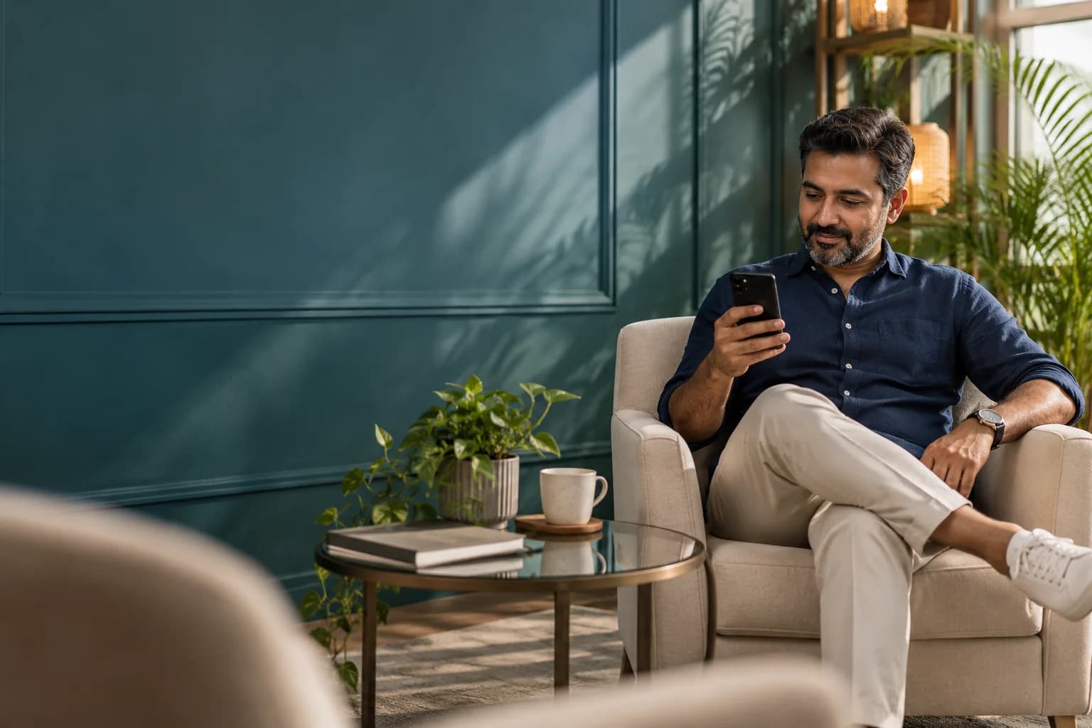 A business owner reading a first enquiry in a quiet lounge